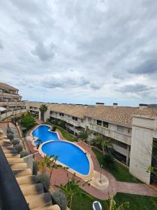 an overhead view of an apartment complex with two pools at Modern Appartement Alenda Golf in Monforte del Cid