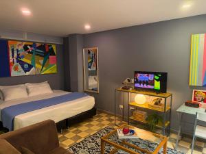 Voodi või voodid majutusasutuse Casa Bugambilia - Alma Hotels toas