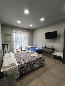 Postel nebo postele na pokoji v ubytování Cuneo Bedroom