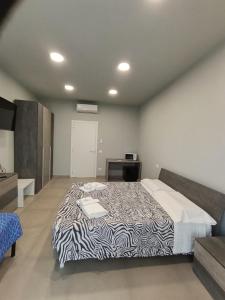 Postel nebo postele na pokoji v ubytování Cuneo Bedroom