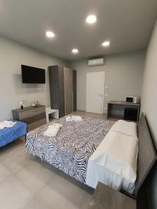 Postel nebo postele na pokoji v ubytování Cuneo Bedroom