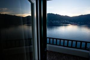 a view of a lake from a window at Astrio Suites in Livadi