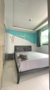 Ένα ή περισσότερα κρεβάτια σε δωμάτιο στο Arcadia beach continental +27 φωτογραφίες