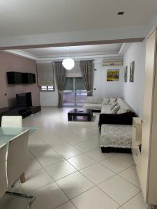 a large living room with a bed and a couch at Orikum Beach Loft in Orikum
