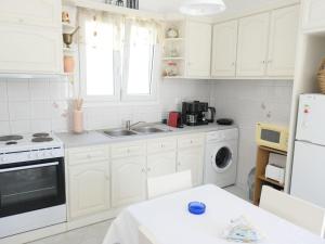 Kuchyň nebo kuchyňský kout v ubytování Valentina City Apartment + 9 fotografií