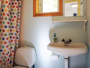 a bathroom with a sink and a toilet at 5 person holiday home in FJÄLLBACKA in Fjällbacka
