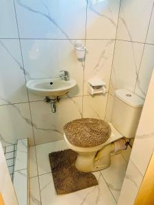 a bathroom with a toilet and a sink at Forest Home Accommodation in De Grendel +37 photos