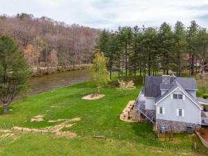 an aerial view of a house next to a river at Riverbank Retreat in Jefferson