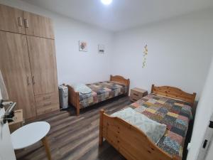 Postel nebo postele na pokoji v ubytování Kod deda Radosava