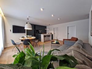 a living room with a couch and a table at Meridian in Gehrden