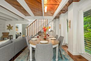 a dining room with a table and chairs at Emmalani 3BR Princeville Villa with Private Pool in Princeville