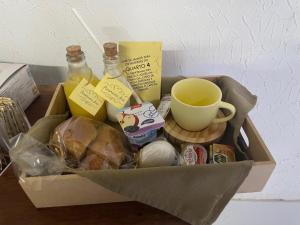 a box filled with food and a cup of coffee at Panorama Inn in Rio de Janeiro