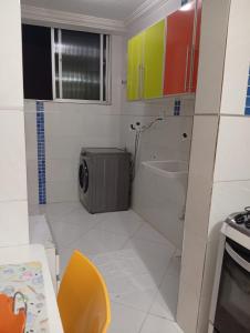 a small bathroom with a toilet and a sink at Ap Família Shopping Riomar e Praia in Aracaju