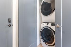 a laundry room with a washer and dryer at Mira at The Lucy by Stay Local Nashville in Nashville +59 photos