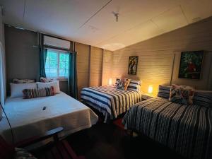 Rúm í herbergi á Villa Aurora Ardilla