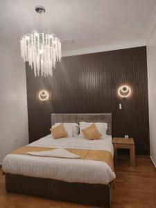 Postel nebo postele na pokoji v ubytování As Salam Apartment
