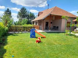 a childs toy in the yard of a house at Vikendica i apartman HS in Pirot