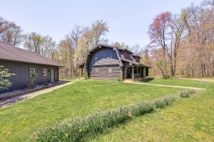 a house with a large yard in front of it at 4 Mi to Dtwn Spacious Family Cabin in Jonesville! in Jonesville