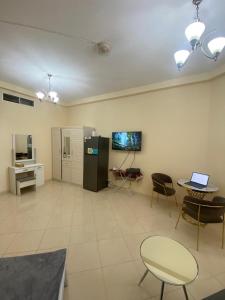 Kuchyň nebo kuchyňský kout v ubytování Cozy Studio In Orient Towers Ajman