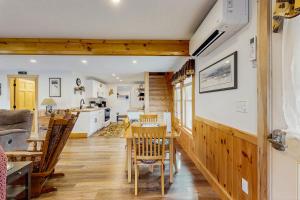 a kitchen and dining room with a table and chairs at The Grouse House in Greenville