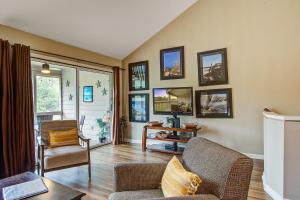 a living room with a couch and a tv at Creekwatch 1245 in Seabrook Island +38 photos