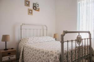 Postel nebo postele na pokoji v ubytování Siogkas Inn
