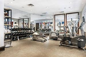 a gym with several treadmills and exercise machines at Luxe 4 Bedroom Beaver Creek Lodge Condo With Ski In, Ski Out Access in Beaver Creek