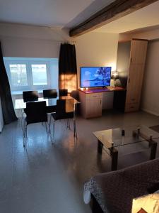 TV a/nebo společenská místnost v ubytování Mäo Apartment