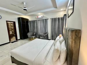 Postel nebo postele na pokoji v ubytování Comfort Family Lodges