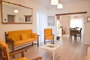 a living room with a couch and a table at Domus Aromatica in Assisi