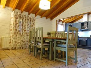 a dining room with a table and chairs at Chalet con piscina privada in Borriol