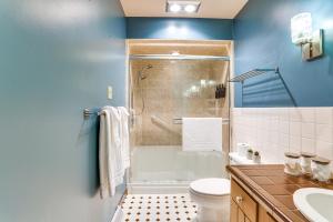 a bathroom with a shower and a toilet and a sink at half Mi to Boat Ramp Lake Wallenpaupack Retreat! in Lakeville +20 photos