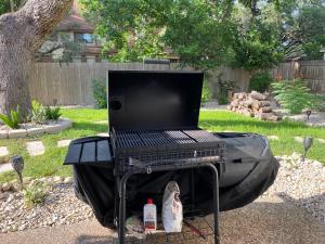 a grill with a laptop computer on top of it at The Ultimate Staycation in San Antonio