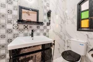 a bathroom with a sink and a toilet at 16 Riads in Marrakesh