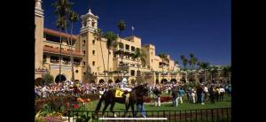 a crowd of people and a horse in front of a building at Romantic stay in Solana Beach in Solana Beach