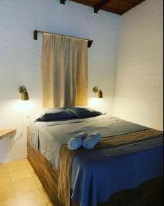 Postel nebo postele na pokoji v ubytování Hotel Monte del Mago