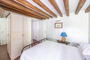 Posteľ alebo postele v izbe v ubytovaní Cà Gamba by Venicevillas, Guglie