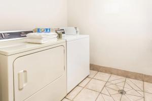 a white washer and dryer in a room at Brush Inn and Suites in Brush