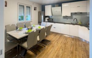 a dining room with a table and chairs in a kitchen at Amazing Home In Crikvenica With Wifi in Crikvenica