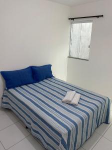 Ένα ή περισσότερα κρεβάτια σε δωμάτιο στο Apartamento dois quartos a 5 min da Rodoviária