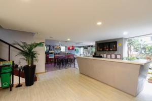 a restaurant with a counter and a bar in a room at Luxury Laureles-LA 70-Medellin Stunner in Medellín