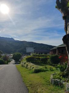 a road with a view of a mountain at Vista Boquete Apartments in Bajo Boquete