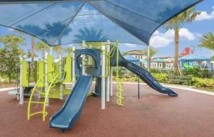 a playground at a park with a slide at Exceptional House 5BD4.5BA Private Pool WW8907 in Kissimmee