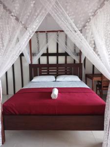 Tempat tidur dalam kamar di Alen's Stay&surf
