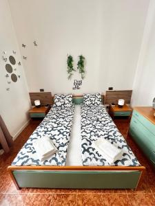 Giường trong phòng chung tại Residence Olivova