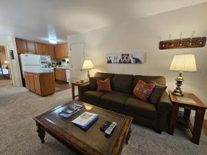 a living room with a couch and a table at Pinenut Place home in Incline Village