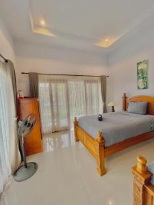 Postel nebo postele na pokoji v ubytování Sekumpul Accommodation + 37 fotografií
