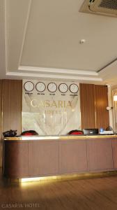 a sign for a casinouth hotel in a room at Casaria Hotel in La Phù