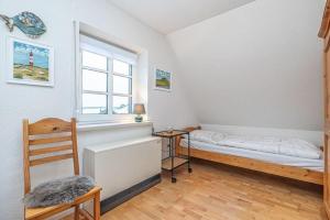 En eller flere senge i et værelse på Hus-Freesland