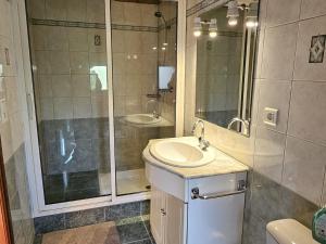 a bathroom with a sink and a shower at Gîte 8 personnes avec cheminée et SPA à Biron - FR-1-616-481 in Biron +13 photos